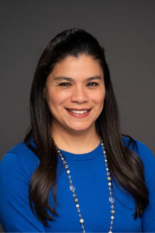 Mayra smiling for her GVSU headshot